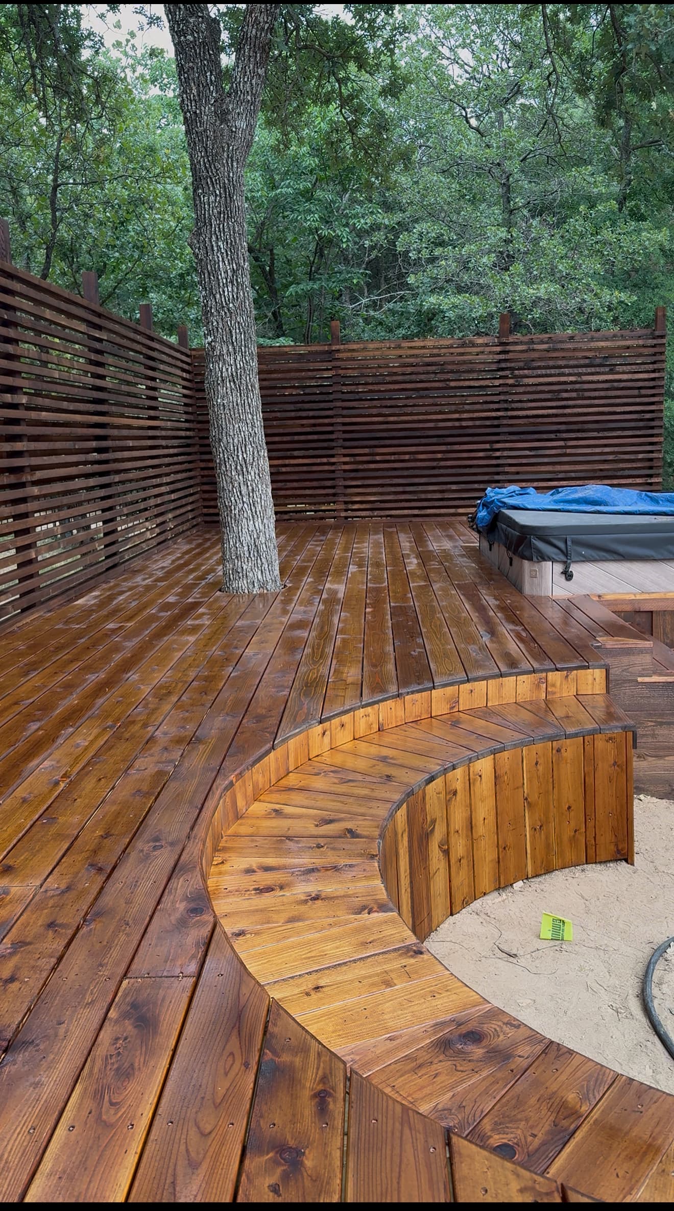 Curved Deck Gathering Space by Titan Built Outdoors