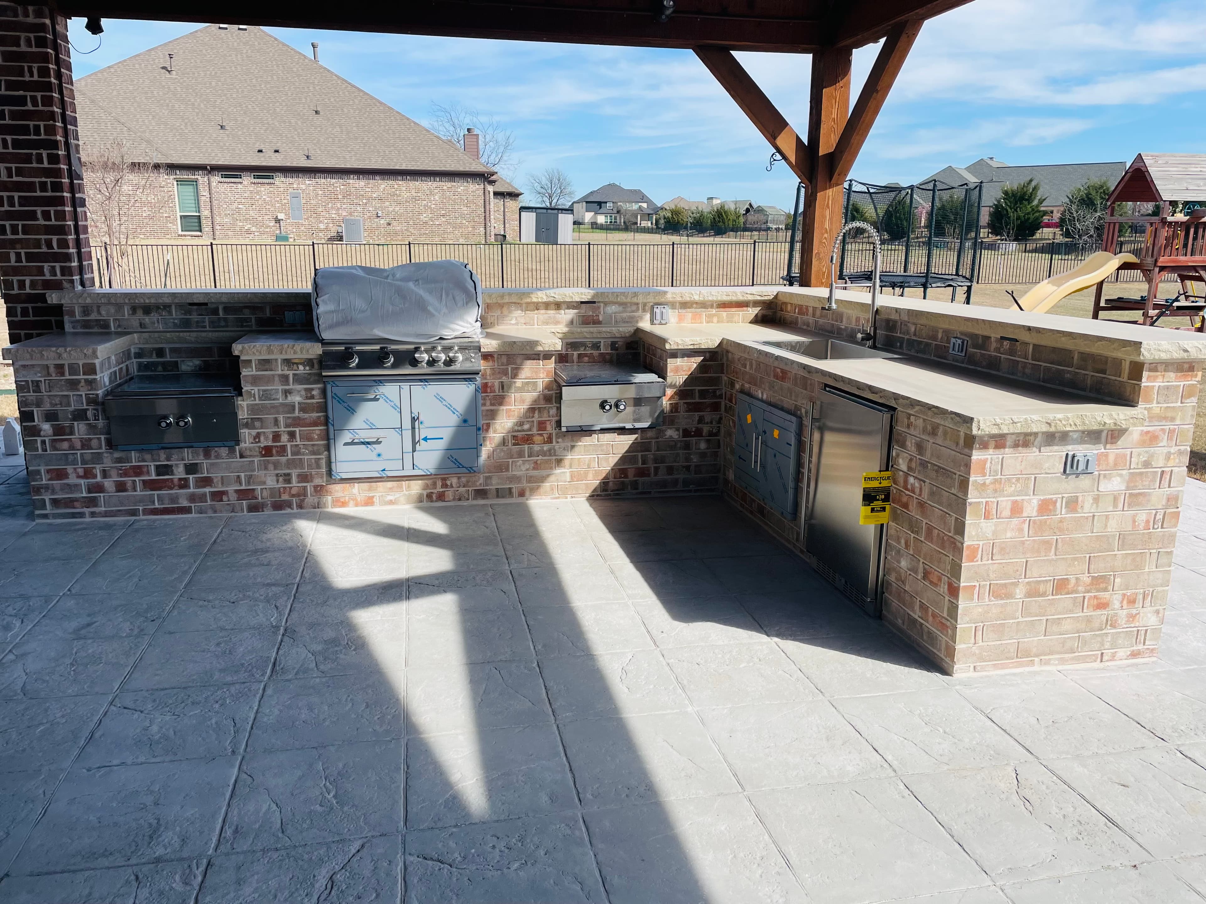 Stone Layout Kitchen by Titan Built Outdoors