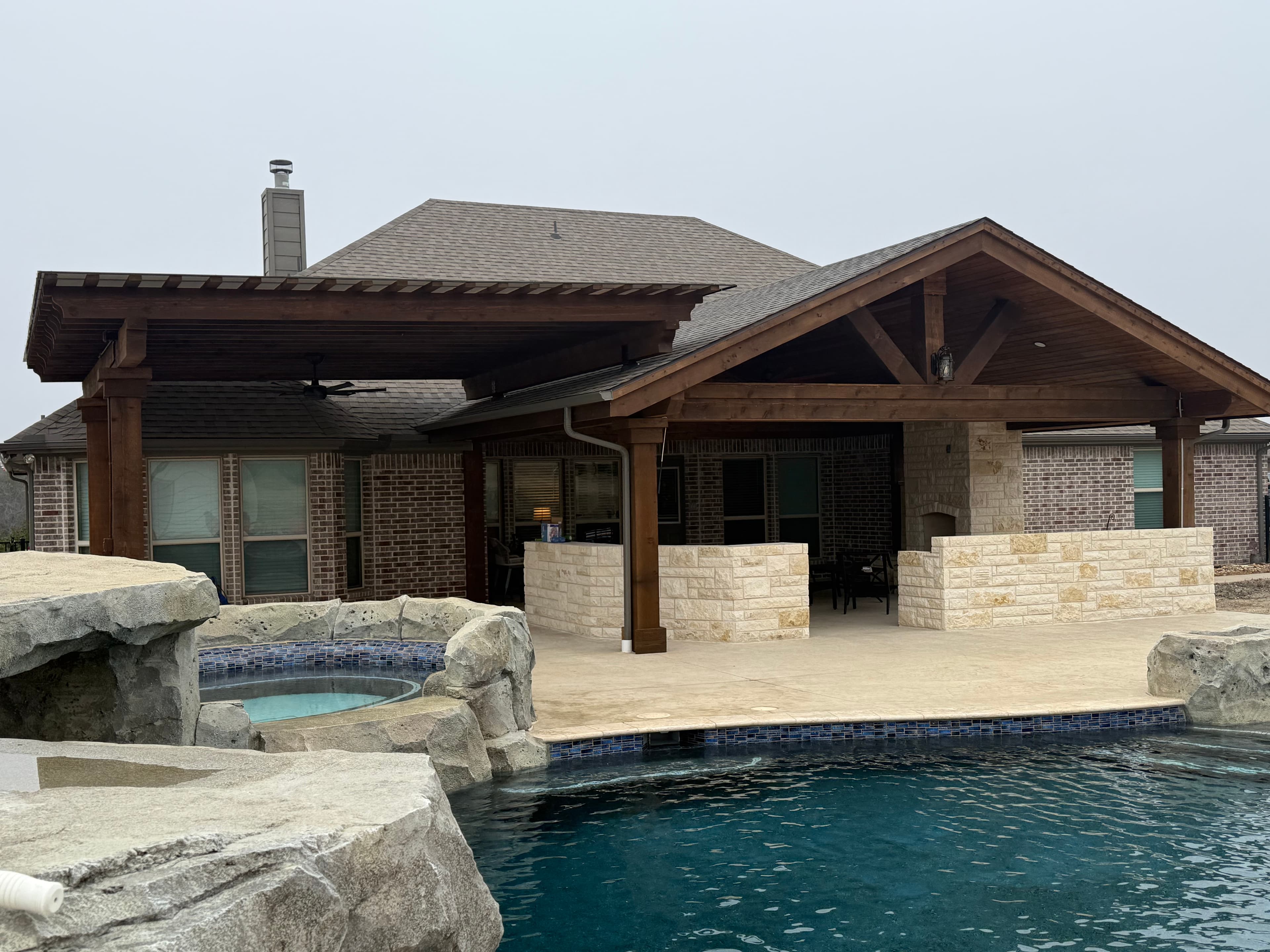 Gable patio cover in a backyard setting